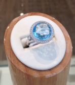 Blue Topaz Dinner Ring with a diamond halo accent