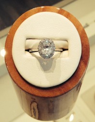 Oval Cut Diamond with a single halo border.